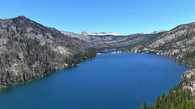 Echo Lakes and summit with desolation wilderness taken from a aerial point of view. The burn scars from the 2022 Caldor fire are evident and the forest hasn&rsquo;t recovered yet. Views also of  Lake Tahoe.