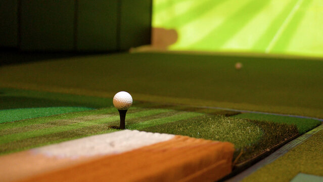 Close Up of a Golf Ball on a Tee in Simulator