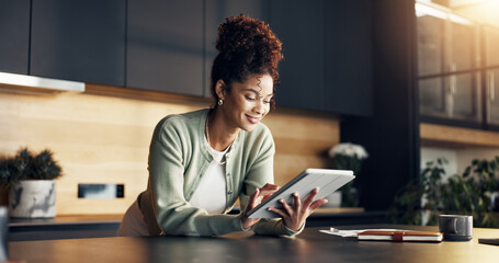 Finance, woman and happy with tablet in home for insurance payout, loyalty reward and review. Budgeting, african person and smile with digital wallet for positive credit score, tax refund and wealth © peopleimages.com