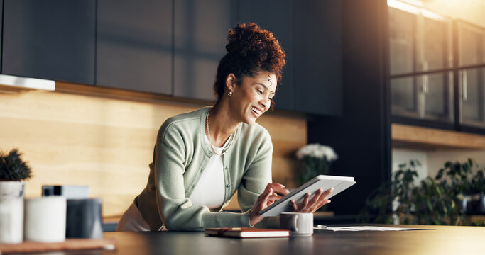 Finance, woman and happy with tablet in kitchen for insurance payout, loyalty reward or review. Budgeting, african person and smile with tech in home for positive credit score, tax refund or cashback