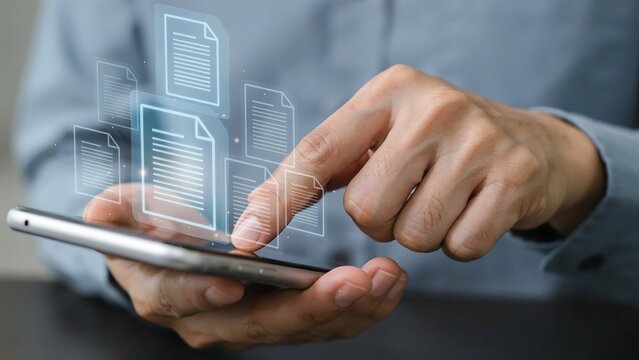 Person interacting with tablet displaying documents and icons on screen