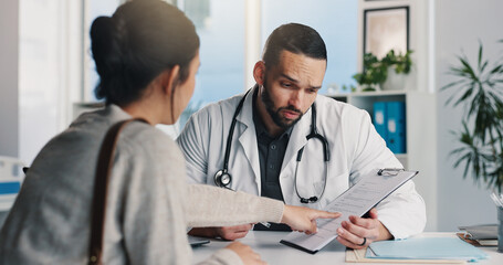 Fototapeta premium Healthcare, doctor and man with clipboard, consultation and medical advice for patient or discussion. Health professional, talking and explaining diagnosis to person, pointing and question in clinic