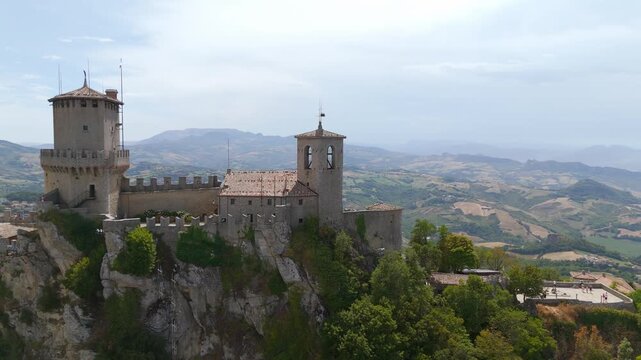 Aerial drone view circling Cesta Tower on Monte Titano, San Marino