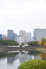 Fototapeta premium Reflection of Tokyo skyline over the Imperial Palace moat, Japan