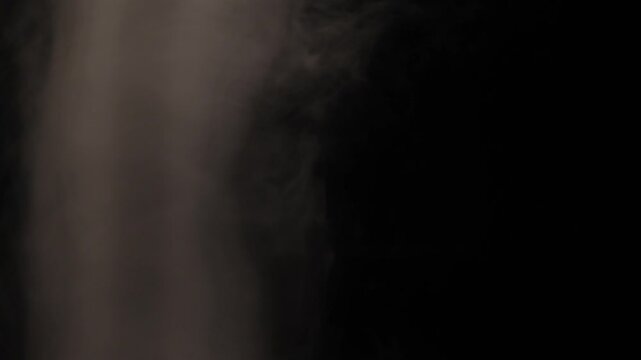 otating white smoke on a black background, creating elegant swirling patterns and atmospheric motion. Abstract smoke movement with soft textures, flowing shapes, and dramatic contrast, ideal for visua