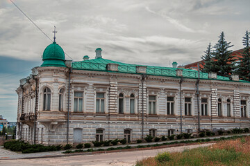 Old town landmark: white ornate building with green turret dome  © Дмитро Ганжеєв