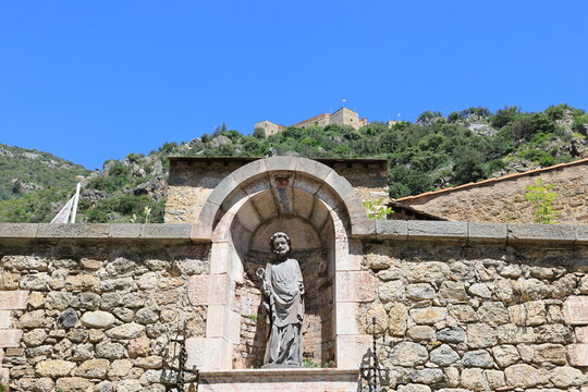 Holy statue in a romantic alley in the medieval town of Villefranche-de-Conflent, France 