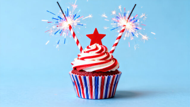 Red, white, and blue starspangled cupcake aglow with a lit sparkler amidst a festive summer evening