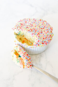 A spoonful of the viral dot cake with colourful sprinkles