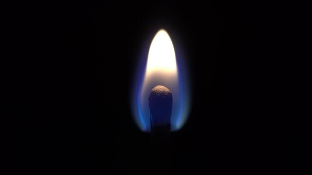 A match is lit and burns with fire on a black background, a match burns close up.mp4, A match is lit and burns with fire on a black background