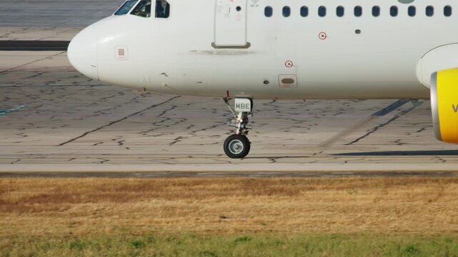 The wheels of a passenger plane are driving along the airport runway. Travel and transport aviation, air travel is fast, convenient and safe