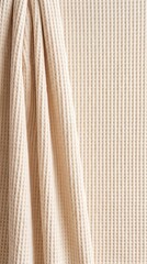 Obraz premium Cream Waffle Cotton Fabric Background with Soft Towel Texture and Vertical Draped Folds
