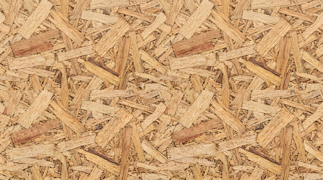 Wood Chip Texture: A close-up view showcases the intricate texture of compressed wood chips, forming a natural and organic background with an industrial appeal.