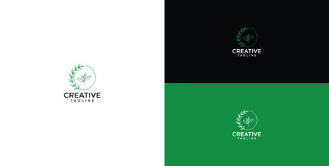 Fototapeta premium Minimalist Organic Nature Logo Design for Creative Studio Featuring a Green Laurel Wreath and Leaf Icon