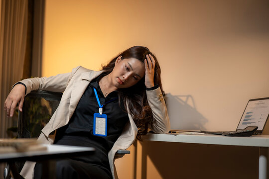 Stressed business woman feeling exhausted from overworking