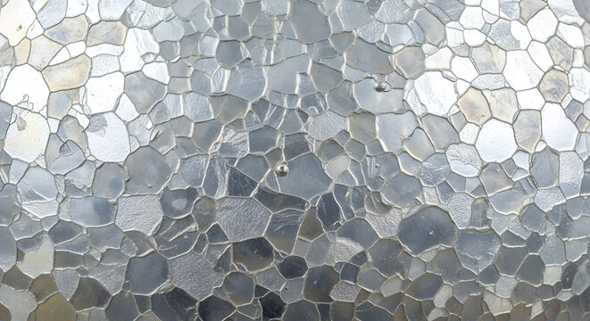 Abstract textured glass pattern background with mosaic shapes and light reflections