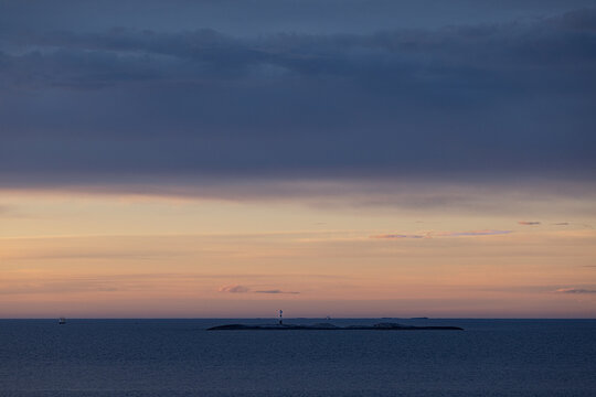 beacon on an islet at sunset, Atlantic Road, Norway