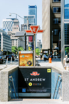 Toronto, Canada - June 4, 2026: St Andrew Subway Station Entrance with Downtown Skyscrapers