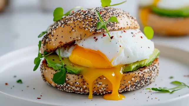 toasted everything bagel (covered in sesame, poppy seeds, garlic, onion, and salt) serves as the base for creamy smashed avocado, a perfectly poached egg