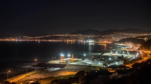 Night view of Valparaiso port Chile with glowing city lights