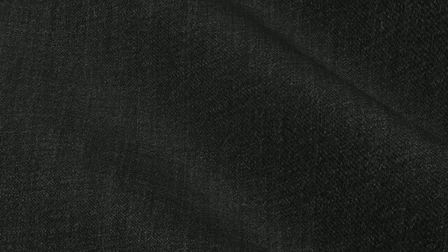 Italian Dark Gray Wool Fabric forming premium charcoal waves as it moves with tailored suit quality for high end mens winter fashion garments
