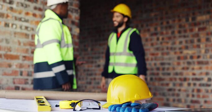People, helmet and high five on construction site with equipment, certified safety and project success. PPE, happy men and celebration in building for engineering goals, hard hat and collaboration.