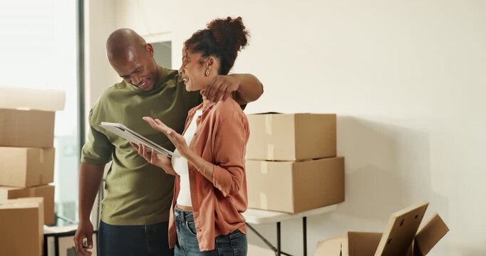 Moving, tablet and couple in new home with boxes for interior designing and online shopping. Real estate, mortgage and people with digital tech for ecommerce purchase and discussion in apartment