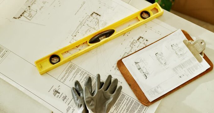 Empty, architecture and blueprint on table with clipboard, construction or building design. Floor plan, paperwork or industry with ppe, equipment and tools for infrastructure development or documents