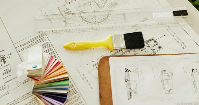 Paperwork, architecture and blueprint on table with clipboard, construction or interior design. Floor plan, paintbrush or empty with swatches, equipment or tools for infrastructure development