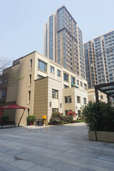 Modern residential apartment buildings and skyscrapers with a clean outdoor courtyard plaza © Joshua