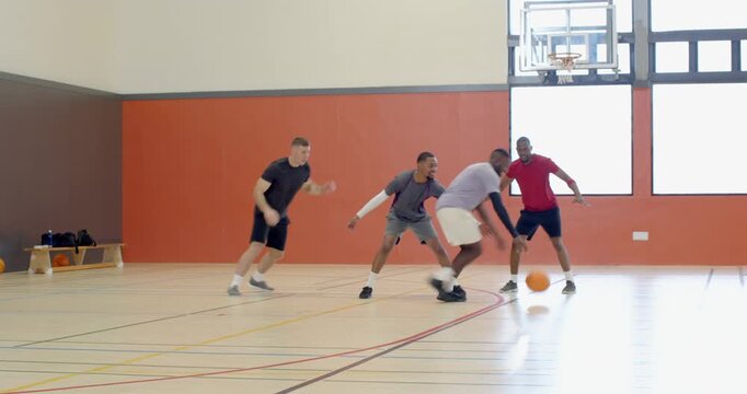 Diverse athletes dribbling crossover and shooting jumper after defense, celebrating on court