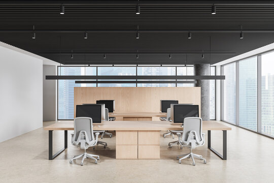 Modern open space office interior with wooden desks, ergonomic chairs, wide city view windows, clean minimalist design and contemporary workspace atmosphere. 3D Rendering