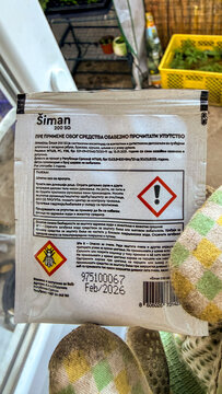Close up pesticide product label on a windowsill in natural daylight, hazard symbol visible, suitable for gardening guides and agricultural editorial, 5 May 2026 Subitica, Serbia