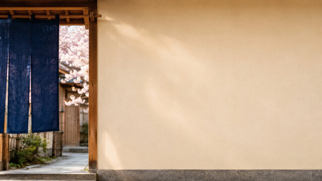 Traditional Japanese Entrance with Indigo Noren Curtain and Cherry Blossoms Copy Space
