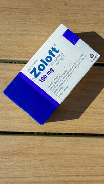 Zoloft 100 mg box on wood table in clean natural light with soft shadow suitable for medical editorial patient education and healthcare marketing, 5 May 2026 Subitica, Serbia