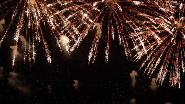 Amazing real beautiful colorful fireworks background on celebration night event for happy new year party, independence day, festivals, Abstract Multi color golden firework in the night sky