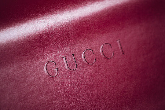 Nice, France - March 1, 2026: Red Gucci leather eyeglasses case photographed in a studio setting, featuring embossed Gucci branding, smooth leather finish and luxury accessory craftsmanship