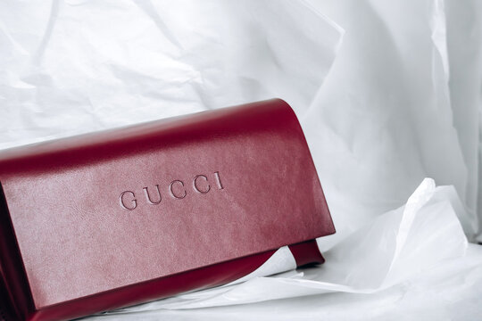 Nice, France - March 1, 2026: Red Gucci leather eyeglasses case photographed in a studio setting, featuring embossed Gucci branding, smooth leather finish and luxury accessory craftsmanship