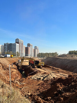 Large excavation site prepared for new highway construction project. Ideal for infrastructure ads, engineering campaigns, transport industry articles.
