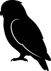 Fototapeta premium A black silhouette of an owl perches quietly on a branch indoors.