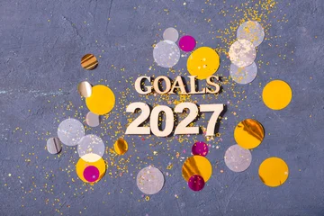 Gardinen Farbenfroh Goals for 2027 spread on a table with colorful confetti and decorations around  © Alina