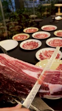 Traditional cut of Iberian ham and gourmet plating