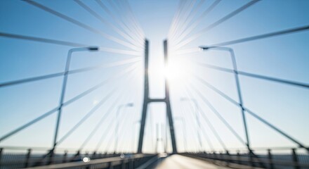 Fototapeta premium Driving across a modern cable stayed bridge into the bright morning sun.