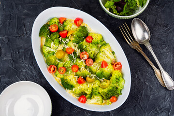 Baked Broccoli and Cheese Gratin with Fresh Cherry Tomatoes © nikolaydonetsk