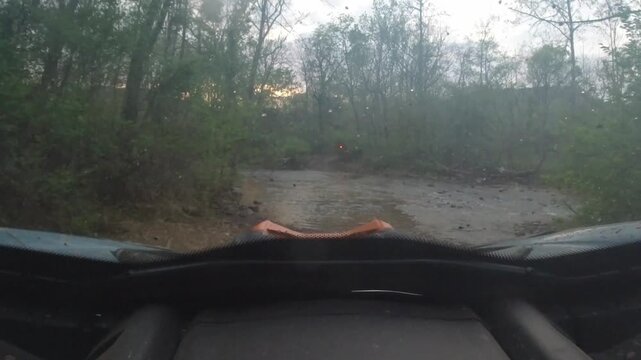 creek crossing in a UTV at twilight in the Ozark mountains