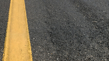 Fototapeta premium Yellow Line on Asphalt Road