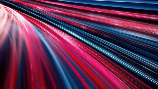 Dynamic light trails in motion create a vibrant flow of red and blue hues, illustrating the speed and energy of a fast-moving vehicle on a dark road