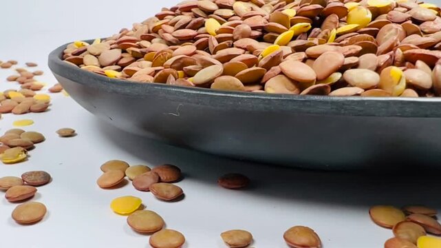 Lentils Close-up Shot, Aromatic Raw Organic Legumes in Bowl on White Background, 16:9 Cinematic Food Footage