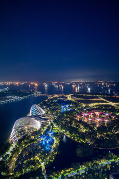 Aerial night view of Singapore waterfront gardens and bay