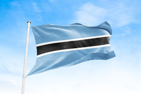 Botswana national flag waving against blue sky